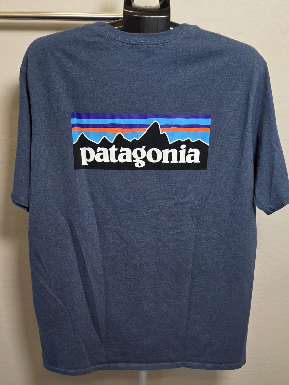 Patagonia Navy Blue Logo Tee with Multi-Color Mountain Graphic